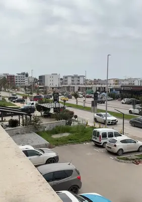 a parking lot with cars parked in a parking lot at Apartman Sofija in Ulcinj