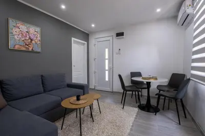 a living room with a couch and a table at Nika house in Cetinje