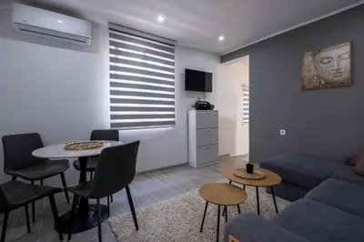 a living room with a couch and a table at Nika house in Cetinje