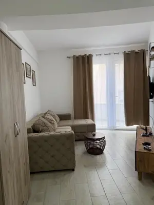 a living room with a couch and a table at Morski kutak in Sutomore