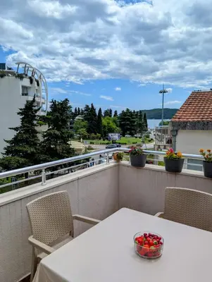 a bowl of fruit sitting on a table on a balcony at Apartment Bjanka in Budva