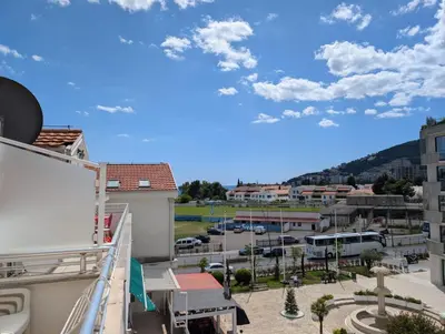 a view from a balcony of a parking lot at Apartment Bjanka in Budva