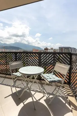 a white table and two chairs on a balcony at Adriatic Harmony in Bar