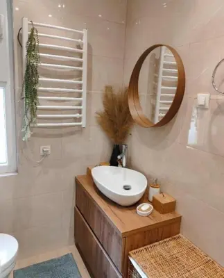 a bathroom with a sink and a mirror at City Center 1 in Podgorica