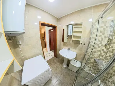 a bathroom with a sink and a shower at Tivat Garden Apartments - Near Airport & Beach, Quiet Stay in Tivat