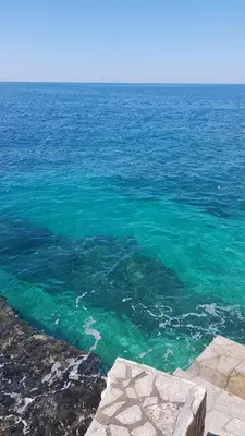 a large body of water with blue water at Emerald Dreamscape with Private Beach & Pool in Dobra Voda