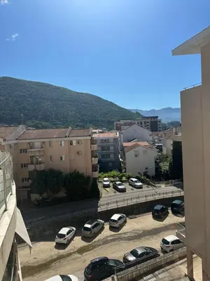 a bunch of cars parked in a parking lot at Apartment ViSi 101 in Budva