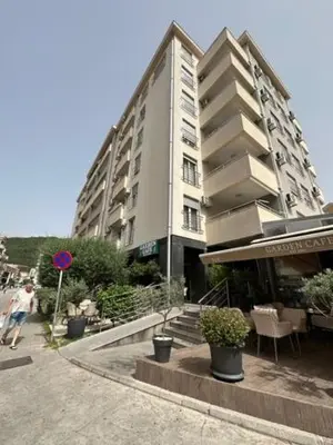 a tall building with plants in front of it at Apartment ViSI 102 in Budva