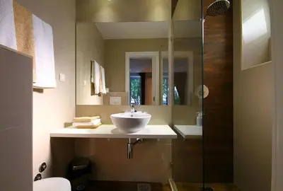 a bathroom with a sink and a glass shower at Apartments Ivanovic in Budva