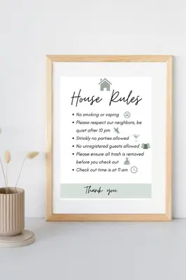 a framed picture of a house bridal shower invitation at NIDA Apartment in Ulcinj