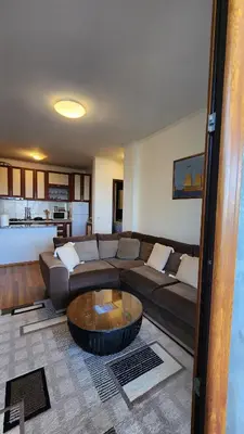 a living room with a couch and a coffee table at Apartment Ulcinj in Ulcinj