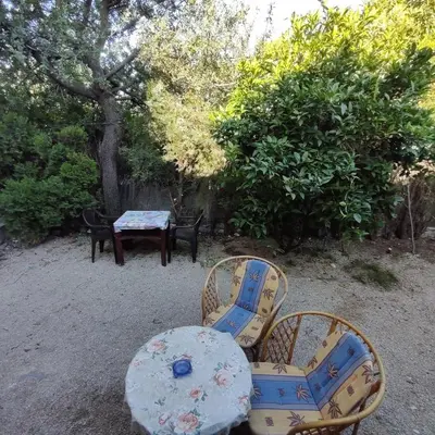 a table and two chairs and a table and a table and chairs at Holiday home Sutomore in Sutomore