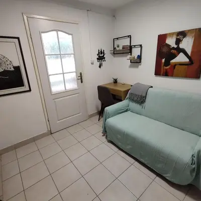 a living room with a couch and a table at Holiday home Sutomore in Sutomore