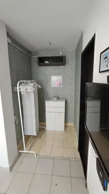a bathroom with a shower and a tiled floor at Holiday home Sutomore in Sutomore