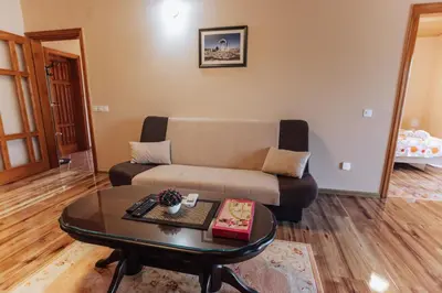 a living room with a couch and a coffee table at Apartman Damjanovic in Cetinje