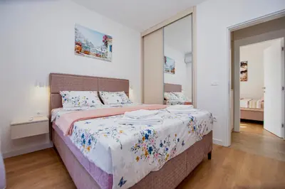 a bedroom with a bed and a mirror at Villa Aurora in Gorovići