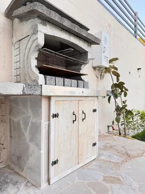 a outdoor pizza oven with a stone building at Villa Aurora in Gorovići