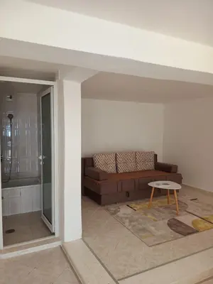 a living room with a couch and a table at Jasmin 2 in Ulcinj