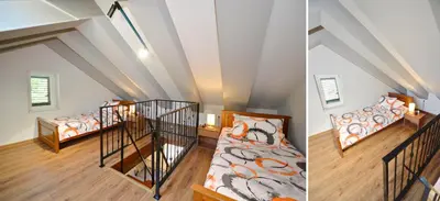 a attic room with two beds and a staircase at Antica Apartments in Kotor