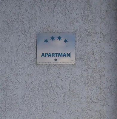 a sign on a wall with stars on it at Apartmani Mulic in Sutomore