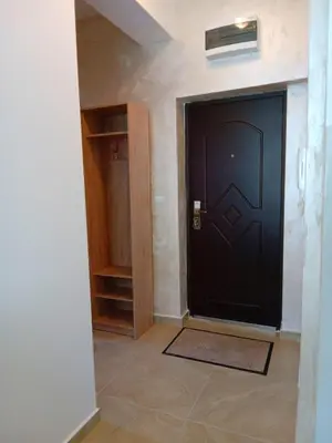 a black door in a room with a tile floor at Cosy 1 bedroom apartment BUDVA in Budva