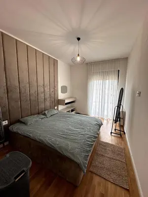 a bedroom with a large bed and a window at Where Comfort Meets Convenience! in Stara Varoš