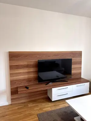 a living room with a flat screen tv on a wall at Where Comfort Meets Convenience! in Stara Varoš