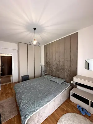 a bedroom with a large bed and a television at Where Comfort Meets Convenience! in Stara Varoš