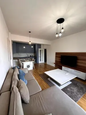 a living room with a couch and a flat screen tv at Where Comfort Meets Convenience! in Stara Varoš