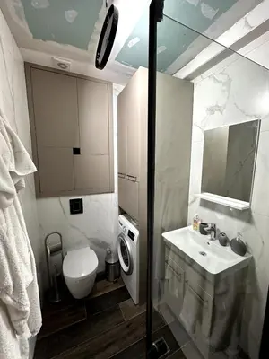 a bathroom with a sink and a toilet and a mirror at Where Comfort Meets Convenience! in Stara Varoš