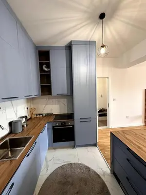 a kitchen with white cabinets and a counter top at Where Comfort Meets Convenience! in Stara Varoš