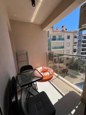 a room with a balcony with a view of a building at Apartment Montenegro Becici in Becici