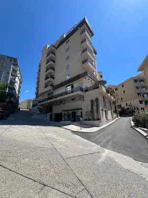 a tall building on the side of a street at Apartment Montenegro Becici in Becici