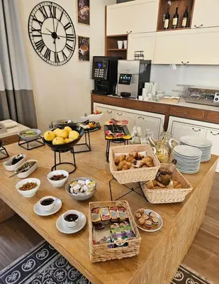 a table with many baskets of food on it in a kitchen at Apartment Montenegro Becici in Becici