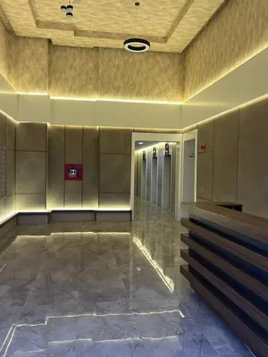a lobby with a row of elevators in a building at Sal y Sol in Bar