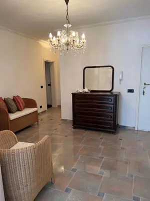 a living room with a mirror and a dresser at Montenegro Seaside Lux Apartment in Petrovac na Moru