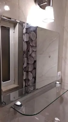 a bathroom with a large mirror and a mirror at Lilian Apartments in Budva