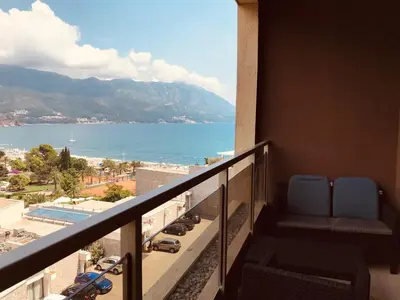 a balcony with chairs and a view of the ocean at Harmonia Apart Hotel in Boreti