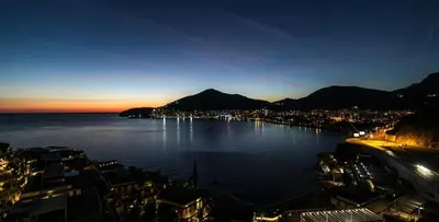 a large body of water with a city and mountains at Harmonia Apart Hotel in Boreti