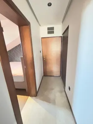 a hallway with a door leading to a bedroom at Loft Suite in Budva