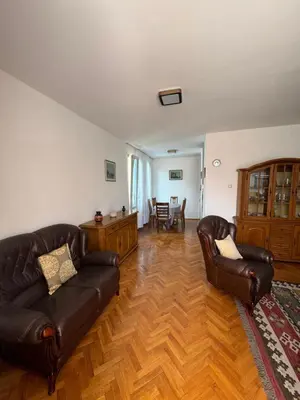 a living room with two leather chairs and a couch at Apartman OLIVA3 in Petrovac na Moru