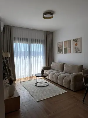 a living room with a couch and a table at Namai Apartments in Ulcinj