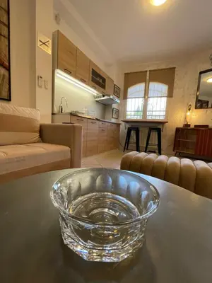 a glass bowl on a table in a living room at Apartman Sahat kula in Podgorica