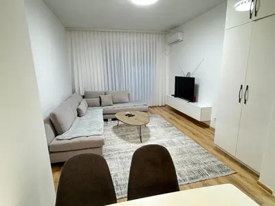 a living room with a couch and a tv at ANI apartment 1 in Ulcinj