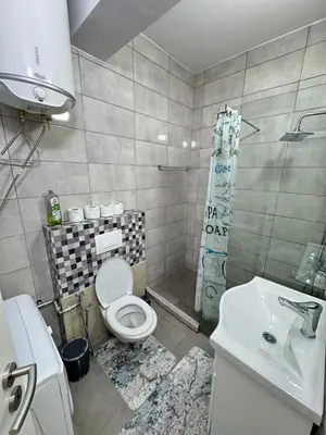a bathroom with a toilet and a sink at ANI apartment 1 in Ulcinj