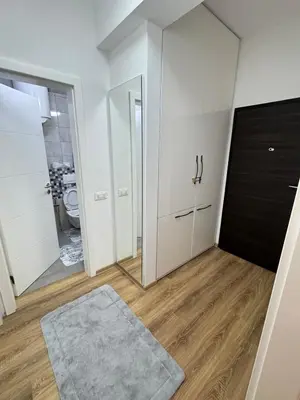 a bathroom with a toilet and a mirror at ANI apartment 1 in Ulcinj