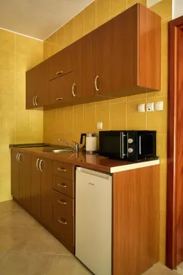 a kitchen with a sink and a microwave at Cremo House in Krimovice