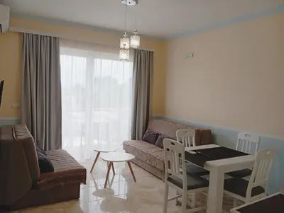 a living room with a couch and a table at Apartman Zefir Ulcinj in Ulcinj