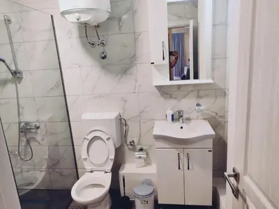 a bathroom with a toilet and a sink and a shower at Apartman Zefir Ulcinj in Ulcinj