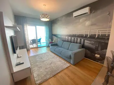 a living room with a couch and a bunk bed at Ekaterina1-KS in Becici